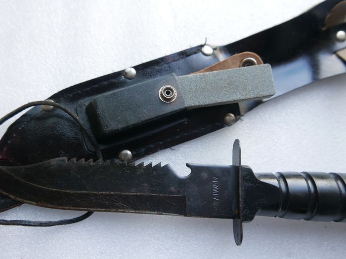 Vintage 1980s Survival Knife with compass and a storage compartment in the knife handle