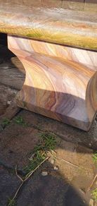 Sandstone garden table and two benches.