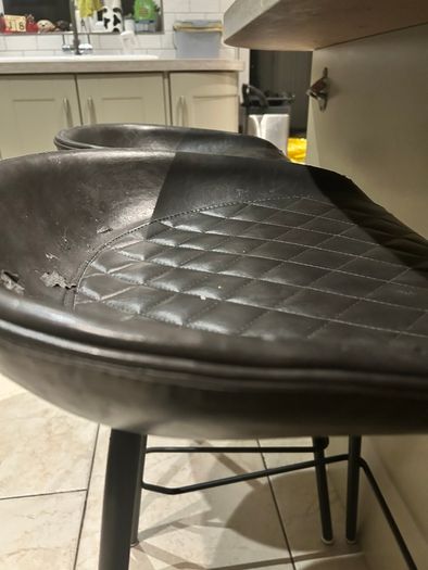 Three  black quilted kitchen bar stools
