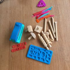 Assorted play doh tools and toys