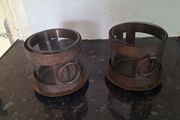 Two rustic pillar candleholders with glass inserts