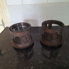 Two rustic pillar candleholders with glass inserts