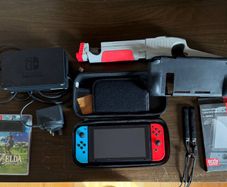 Nintendo Switch + Zelda BOTW ideal condition full pack + cases + protection glass