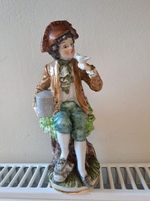 Vintage boy with bird figurine Capodimonte style