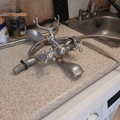 Bath mixer tap with shower hose