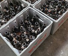 Grolsch beer brown glass bottles with porcelain swing caps.