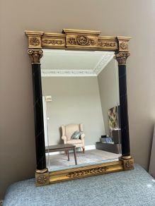 Gilt and black regency style mirror