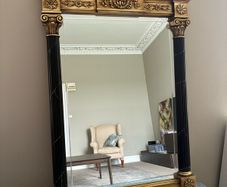 Gilt and black regency style mirror