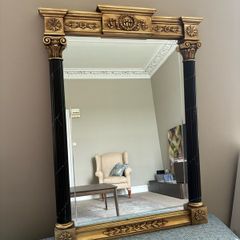 Gilt and black regency style mirror