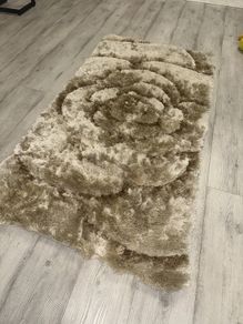 Small gold beige rug