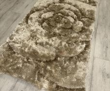 Small gold beige rug