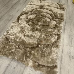 Small gold beige rug