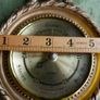Vintage barometer with silvered dial mounted in an ornate gilt frame. Image 6