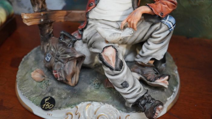 Porcelain Figurine of Seated Elderly Man with Birds