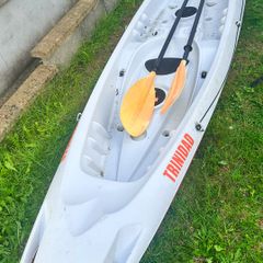 2+1 family sit on kayak
