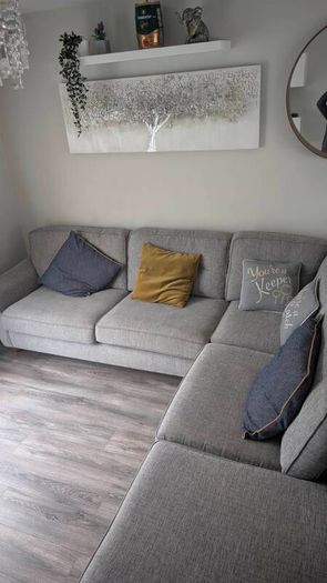 Gray fabric corner chase sofa with footstool