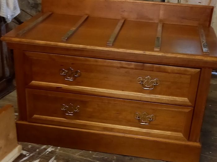 Chest with suitcase set down on top