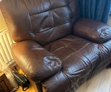 Brown leather recliner for sale in good condition.