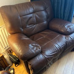 Brown leather recliner for sale in good condition.