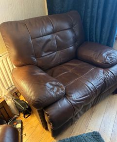 Brown leather recliner for sale in good condition.