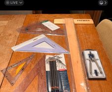 Technical Drawing with compass pencils 45 and 60 degree set squares and adjustable set square and wooden tee square