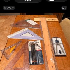 Technical Drawing with compass pencils 45 and 60 degree set squares and adjustable set square and wooden tee square