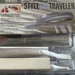 Portable, battery-operated manicure system designed for travel.