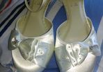 Brand new, never worn ivory satin wedge shoe with satin bow detail.