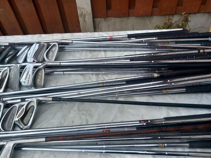 A selection of golf clubs and bags. Golf balls