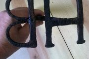 Old Irish blacksmith made branding iron with letters HB