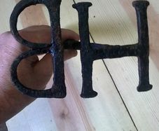 Old Irish blacksmith made branding iron with letters HB