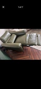 Olive green leather electric recliner armchair