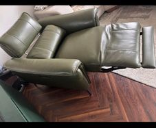 Olive green leather electric recliner armchair