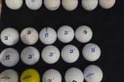 32 Titleist and Bridgestone balls