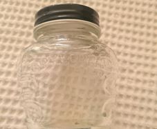 Old glass brylcreem bottle