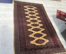 pure wool rug in cream and reds
