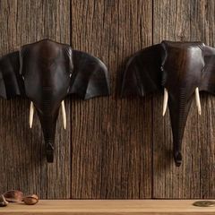 matching pair of hand-carved wooden elephant head