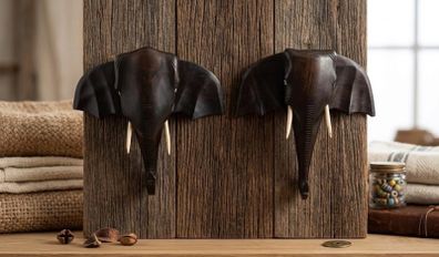 matching pair of hand-carved wooden elephant head