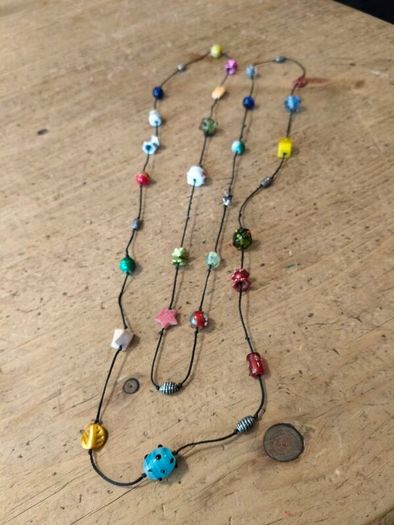 handmade funky necklace featuring a variety of colourful glass and stone beads