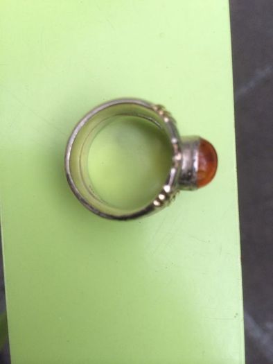 A lovely silver and gold ring with Amber stone