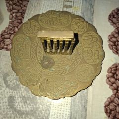 Vintage Middle Eastern or Levantine decorative Brass trinket dish featuring embossed Arabic script and a central colonnade motif depicting historic ruins such as the Baalbek Roman ruins or the Jerash Oval Plaza columns.