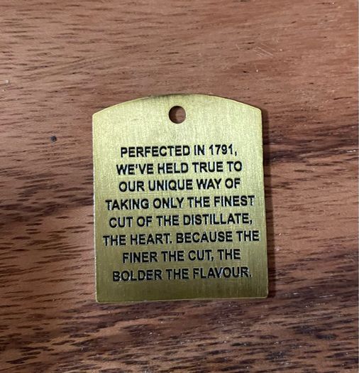 Powers whiskey medal