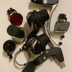 New Shimano Gear Shifters RevoShift SL-RS36-7-LN Twist Grip Shifter for 3 x 7 Speed Mountain bike Includes Gear Cables, Set Black Grips, Aluminium Brake lever, Set Light Reflector, Set Valve Caps and Flick-bell.