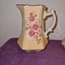 Antique pair of Rockingham Staffordshire floral jugs Image 2