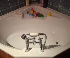 Corner bath with Panelling and Avondale Taps