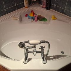 Corner bath with Panelling and Avondale Taps