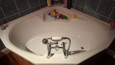 Corner bath with Panelling and Avondale Taps