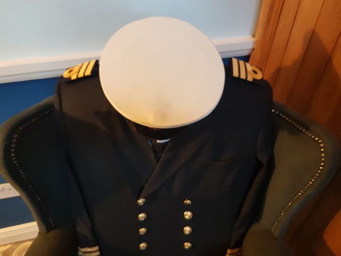 Queen Anne wingback chair / Quirky Ships Commander's uniform.