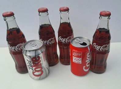 Display Coke Cola Bottles and Vintage Can