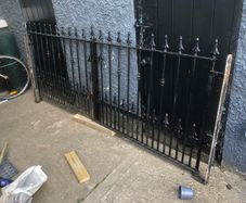Set of wrought iron driveway gates and side gate